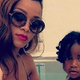 Rihanna and an unidentified child (Instagram via Clutch magazine)